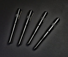 Load image into Gallery viewer, Four Franklin-Christoph Model 02 Intrinsic Black Knight pens with #6 nibs are arranged diagonally on a dark surface.