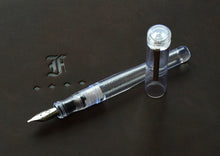 Load image into Gallery viewer, Franklin-Christoph Model 02 Intrinsic Fountain Pen in Italian Ice acrylic with #6 nib, on embossed dark surface.