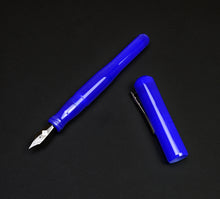 Load image into Gallery viewer, The Franklin-Christoph Model 02 Intrinsic Fountain Pen - Kyanite with its #6 nib exposed, on a black background.