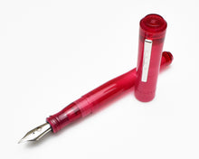 Load image into Gallery viewer, Franklin-Christoph Model 02 Intrinsic Ruby fountain pen with cap off, both nib and cap visible on a white surface.