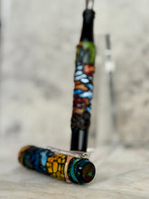 Load image into Gallery viewer, Two Franklin-Christoph 03 A.A. Vacaharat Cathedral of Nature pens rest on a marble surface.