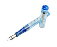 Load image into Gallery viewer, A translucent blue Franklin-Christoph Model 03 Iterum SE shows an Arctic Ice &amp; Orchid Blue marbled nib when capped.