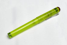Load image into Gallery viewer, A frosted green Franklin-Christoph Model 03 Iterum Fountain Pen with maroon accents sits on a white textured surface.