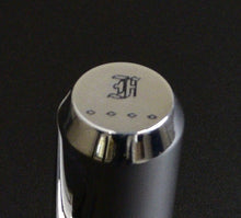 Load image into Gallery viewer, A shiny metal cap from the Franklin-Christoph Model 03 Modified Fountain Pen, H and four dots engraved, on dark background.