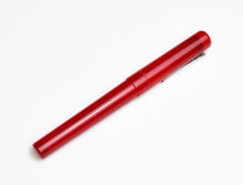Load image into Gallery viewer, A closed Franklin-Christoph Model 03 Iterum Fountain Pen in Venetian Red &amp; Lime rests on a white background.