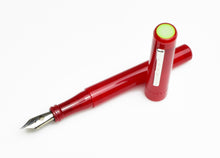Load image into Gallery viewer, A Franklin-Christoph Model 03 Iterum Fountain Pen in Venetian Red &amp; Lime rests on a white background.