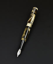 Load image into Gallery viewer, Franklin-Christoph Model 19 Cold Brew special edition fountain pen with #6 nib, gold/black/brown marbled shown on a black background.