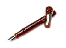 Load image into Gallery viewer, A Franklin-Christoph Model 20 Marietta - Autumn Oak fountain pen, uncapped, lies diagonally on a white background.