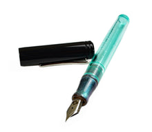 Load image into Gallery viewer, A Franklin-Christoph Model 20 Marietta Andromeda SE fountain pen with a black cap rests on a white background.