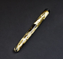 Load image into Gallery viewer, A Franklin-Christoph Model 20 Marietta Cold Brew SE fountain pen rests on a dark textured surface.