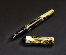 Load image into Gallery viewer, A Franklin-Christoph Model 20 Marietta Fountain Pen in Cold Brew SE acrylic rests on a dark surface.