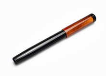 Load image into Gallery viewer, A Franklin-Christoph Model 20 Marietta Copper Rising fountain pen rests capped on a white background.