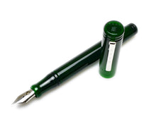 Load image into Gallery viewer, A Franklin-Christoph Model 20 Marietta Fountain Pen in emerald with a silver nib rests uncapped on a white surface.