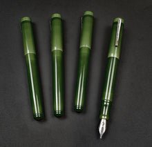 Load image into Gallery viewer, Four jade Franklin-Christoph Model 20 Marietta pens; rightmost uncapped, nib visible, all on a black background.