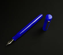 Load image into Gallery viewer, A Franklin-Christoph Model 20 Marietta - Kyanite fountain pen, uncapped, rests on a plain black background.