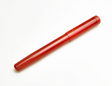 Load image into Gallery viewer, A Franklin-Christoph Model 20 Marietta Fountain Pen in Venetian Red sits on a white surface.