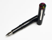 Load image into Gallery viewer, A Franklin-Christoph Model 31 Omnis Black Cathedral fountain pen rests on a white background.