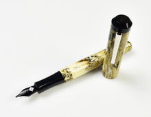 Load image into Gallery viewer, Franklin-Christoph Model 31 Omnis Cold Brew SE fountain pen, marbled yellow-brown with black nib and cap, on white.