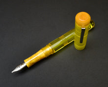 Load image into Gallery viewer, Franklin-Christoph Model 31 Omnis - Disco Lemonade, acrylic fountain pen with silver nib, capped and uncapped shown.
