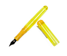 Load image into Gallery viewer, Franklin-Christoph Model 31 Omnis Fountain Pen in Disco Lemonade acrylic, with cap, rests on a white background.