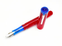 Load image into Gallery viewer, Franklin-Christoph Model 31 Fountain Pen in Venetian Red Maya Blue with #6 nib; cap rests beside it on white background.