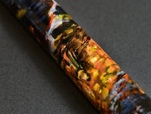 Load image into Gallery viewer, Close-up of the unique Franklin-Christoph 33 A.A. Vacharat Gothic City pen with vibrant strokes on a dark background.