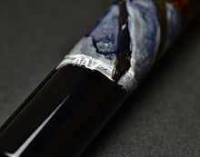 Load image into Gallery viewer, Close-up of the Franklin-Christoph 33 A.A. Vacharat Gothic City pen with a unique, multicolored textured barrel.