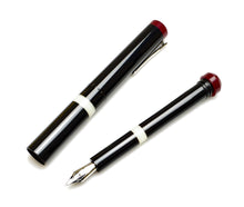 Load image into Gallery viewer, Franklin-Christoph Model 33 Abditus Fountain Pen in black with white band and red accents, uncapped beside its cap.