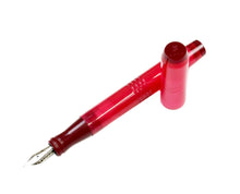 Load image into Gallery viewer, A Franklin-Christoph Model 45 Cor Ruby Maroon Fountain Pen lies uncapped with its cap beside it on a white background.