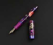 Load image into Gallery viewer, Franklin-Christoph 46 A. A. Vacharat - Cosmic Cats fountain pen, purple, shown on a black background.
