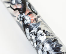 Load image into Gallery viewer, Close-up of Franklin-Christoph 46 A.A. Vacharat - Gothic Blossoms pen with black, white, and gray paint splatters.