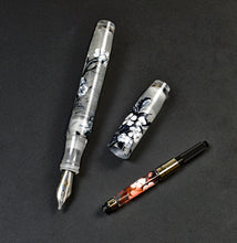 Load image into Gallery viewer, Franklin-Christoph 46 A.A. Vacharat - Gothic Blossoms pen, uncapped with ink converter, displayed on a dark surface.