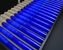 Load image into Gallery viewer, A case displays Franklin-Christoph Model 46 Caribbean Bluestone FPs, each neatly in its slot on a beige tray.