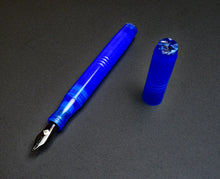 Load image into Gallery viewer, Franklin-Christoph Model 46 Caribbean Bluestone FP (#6 nib), uncapped on a dark gray surface.