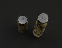 Load image into Gallery viewer, Two marbled Franklin-Christoph Cold Brew Model 46 FP cylinders with engraved, flat-top nibs on a dark surface.