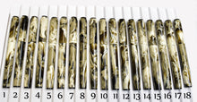 Load image into Gallery viewer, Eighteen Franklin-Christoph Model 46 Cor FP Cold Brew pens in a row, each with #6 nibs and marbled swirls.