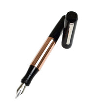 Load image into Gallery viewer, A Franklin-Christoph Model 55 Pentium FP - Black Copper SE fountain pen, uncapped, rests on a white background.