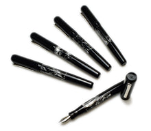 Load image into Gallery viewer, Five Franklin-Christoph Model 55 Pentium FP SE pens, Dark Room Emulsion Black, #5 nibs, on a white background.