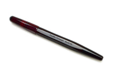 Load image into Gallery viewer, A red Franklin-Christoph Model 66 Septagonal Fountain Pen, called Garnet, rests diagonally on a white background.