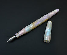 Load image into Gallery viewer, Franklin-Christoph Model 66 Septagonal Opal pen with marbled pastel finish rests beside its cap on a black surface.