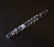 Load image into Gallery viewer, The Franklin-Christoph Model 66 Septagonal in Italian Ice rests on a black surface, showing its block threads.