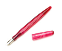 Load image into Gallery viewer, Franklin-Christoph Model 66 Septagonal Ruby fountain pen, eyedropper fill, uncapped on a white surface.