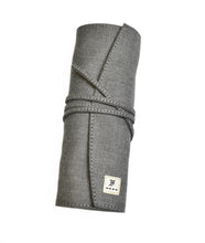 Load image into Gallery viewer, Franklin-Christoph Seven Pen Roll—a gray organizer pouch with tie and stitched label, shown on a white background.