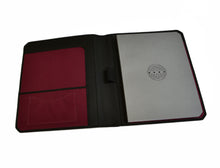 Load image into Gallery viewer, Open black and maroon Franklin-Christoph Scottish Canvas Padfolio with pockets and a circular-design silver notebook.