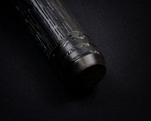 Load image into Gallery viewer, Close-up of Franklin-ChristophModel 03M Delrin Rain Tree, engraved, on a black surface with original artwork by AA Vacharat.