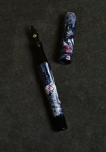 Load image into Gallery viewer, A Franklin-Christoph 03M A. A. Vacharat - City Gothic 1 pen with a winter scene rests on a dark, textured surface.