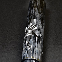 Load image into Gallery viewer, The Franklin-Christoph 03M A.A. Vacharat Flowers on Black stands upright on a dark, textured surface.