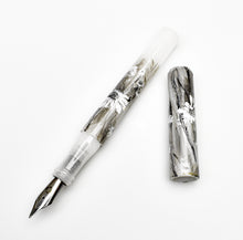 Load image into Gallery viewer, Franklin-Christoph 03M A.A. Vacharat Flowers on Snow fountain pen, white marbled acrylic, silver nib, uncapped.