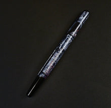 Load image into Gallery viewer, Franklin-Christoph 65 A.A. Vacharat Medieval Castle fountain pen, marbled black/white, shiny cap, #5 nib, diagonal view.