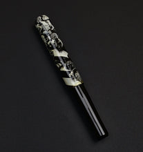 Load image into Gallery viewer, A Franklin-Christoph 40M Rush Hour Rain pen with a marbled cap rests on a dark surface.